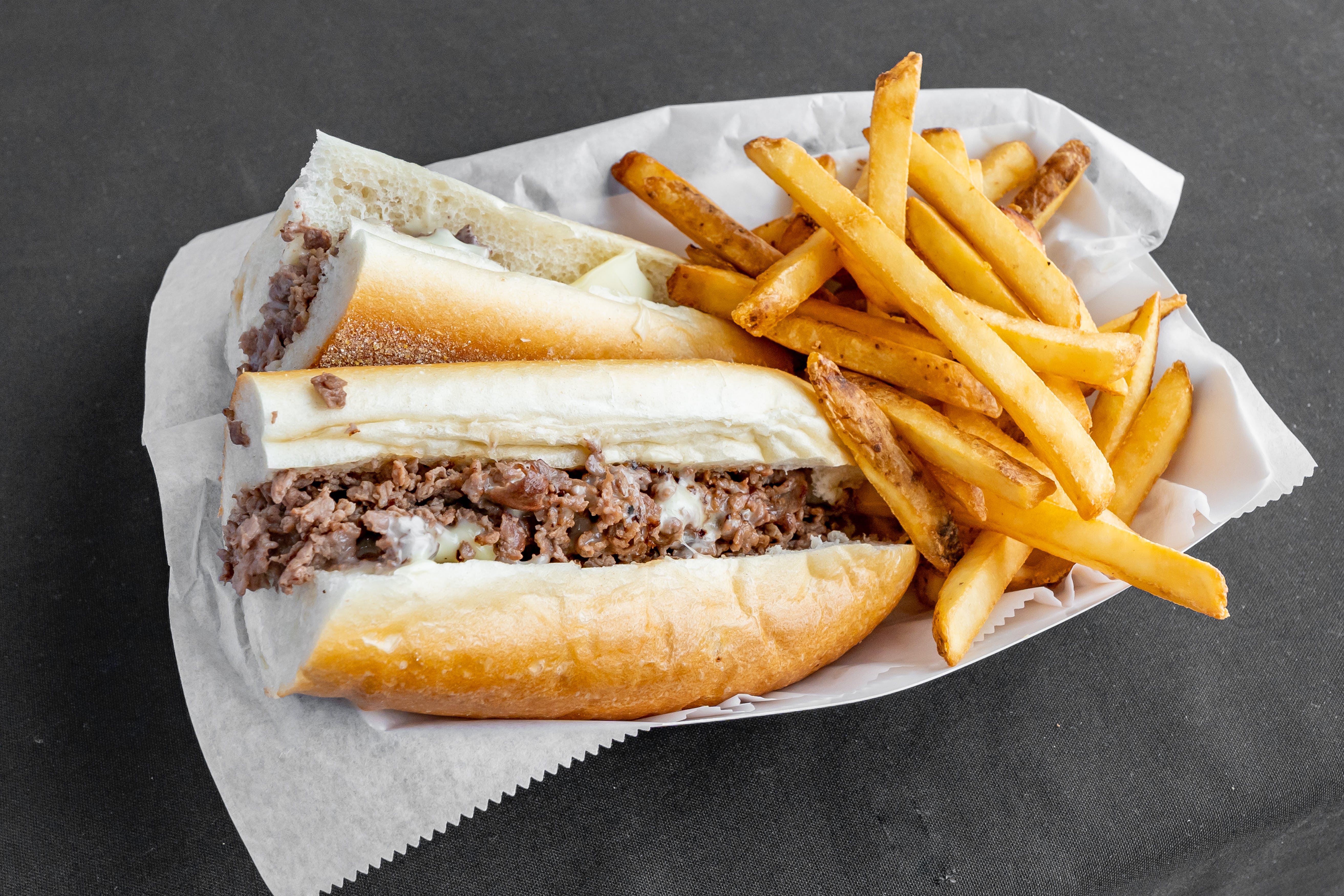 https://slicelife.imgix.net/10617/photos/original/Perkasie_Pizza-Perkasie-PA-Cheesesteak_and_Fries.jpg?auto=compress&auto=format