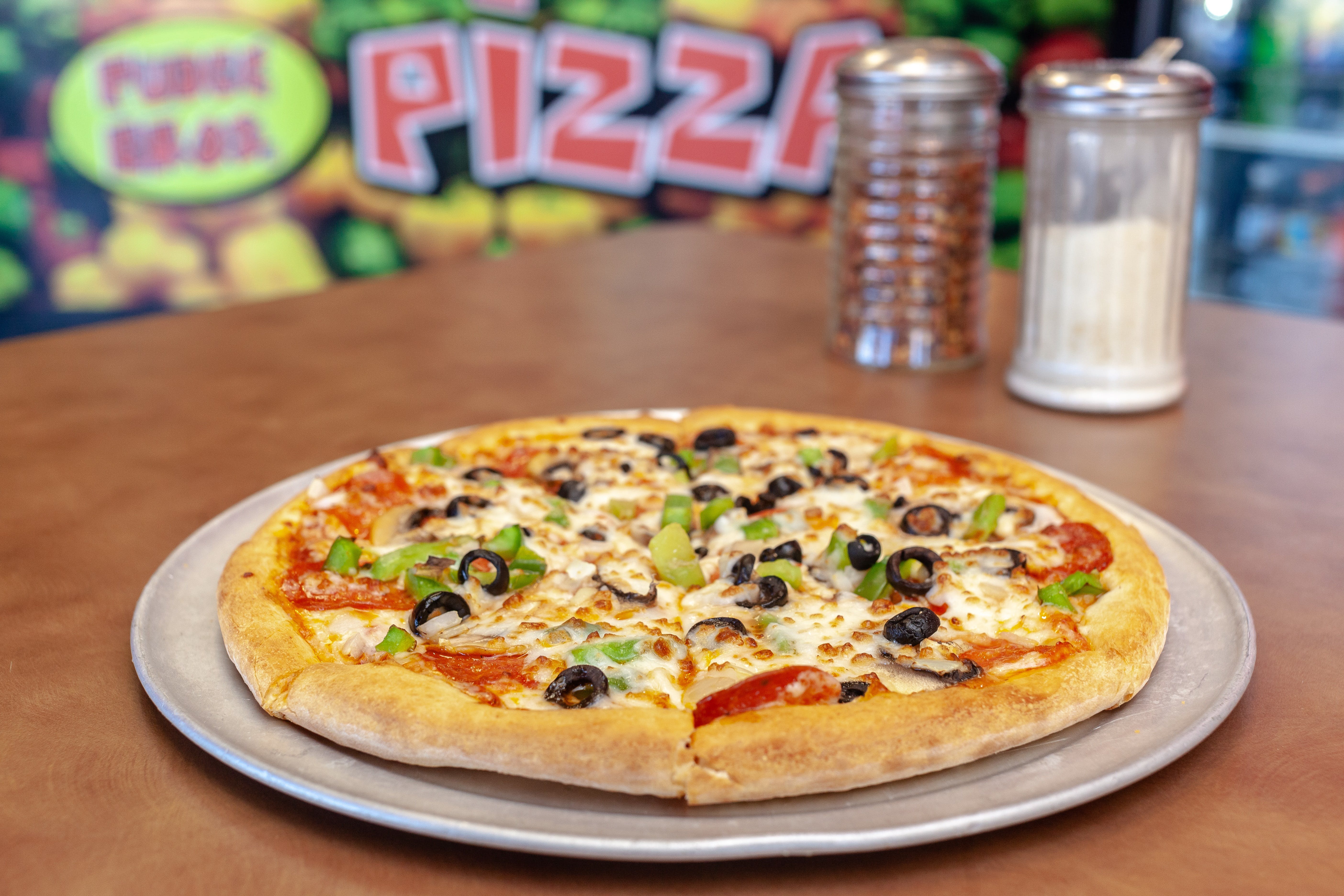 Pudge Bros Pizza Monaco Menu Denver, CO Order Delivery Slice